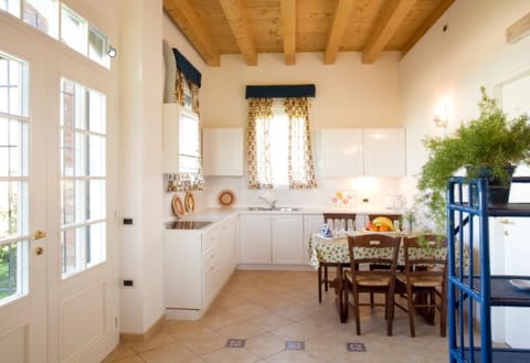 Apartment, 2 Bedrooms, 2 Bathrooms, Garden View (Cormorano) | Private kitchen | Fridge, stovetop, dishwasher, coffee/tea maker