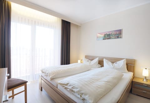 Standard Double Room | Minibar, in-room safe, desk, blackout drapes