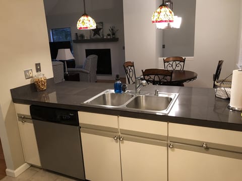 Kitchen view looking to living area and dining area