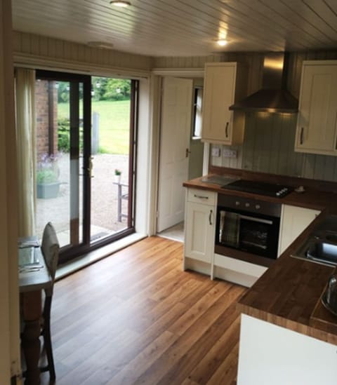 Exclusive Apartment, Ground Floor | Private kitchen | Full-size fridge, microwave, oven, stovetop