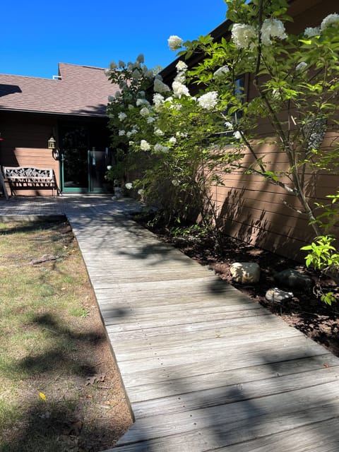Entry to the home leads to a wrap-around deck.