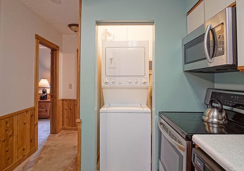 Stack Washer/Dryer in condo in kitchen area