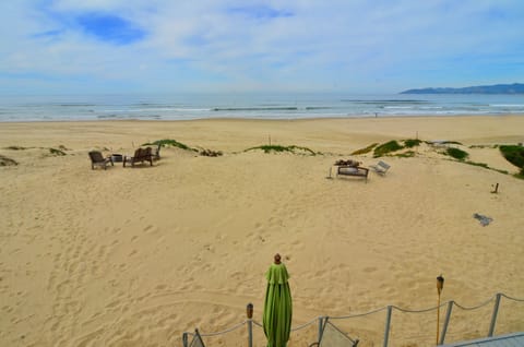 Seagull  firepit and chairs on left.    Sanddollar on right. Sanddollar view.