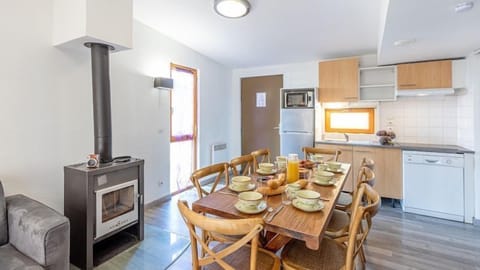 Whip up a meal in the kitchen and enjoy it at the dining table.