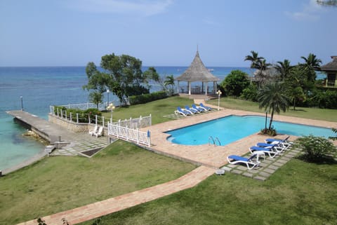View of pool area and beach from the balcony of my apartment.