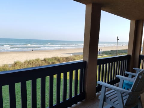 Enjoy your beachfront view sitting on these relaxing arm chairs.