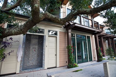 Outdoor shower and half bath. Upstairs master bedroom balcony