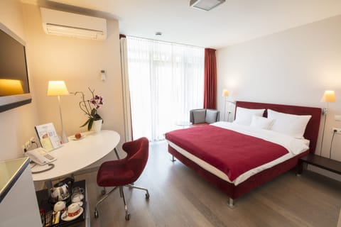 Standard Double Room | Minibar, desk, laptop workspace, iron/ironing board