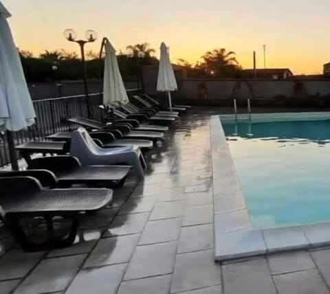 Seasonal outdoor pool, open 8:30 AM to 6:00 PM, pool umbrellas