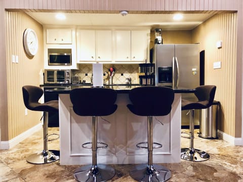 Granite island with seating for four. 