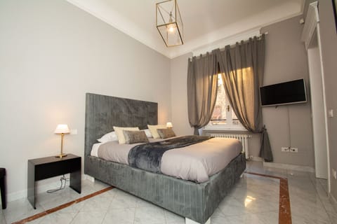 Deluxe Double Room | Desk, blackout drapes, iron/ironing board, cribs/infant beds