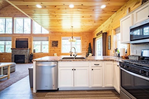 Open concept- looking from kitchen to dining room to great room
