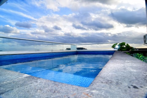Outdoor pool, open 8:00 AM to 10:00 PM, sun loungers