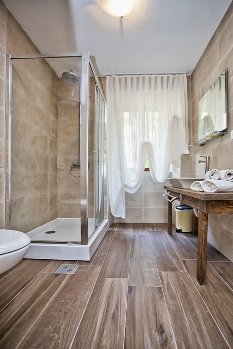 Shower, free toiletries, hair dryer, slippers