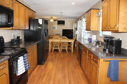 As you enter the home you see through to the dining area and great room TV