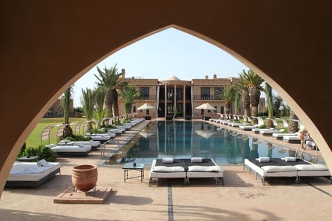 Outdoor pool, pool umbrellas, sun loungers