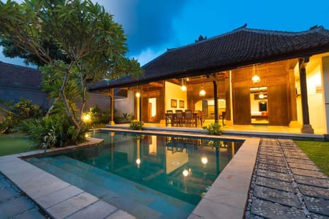 Standard Villa | Living area | 65-inch TV with cable channels