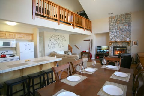 Cathedral ceiling, lightly and airy open concept living room/kitchen area. Loft
