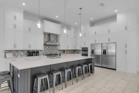 A Sprawling 6 x 12 Granite Island is the Place to Drop your Groceries or Prepare a Huge Meal