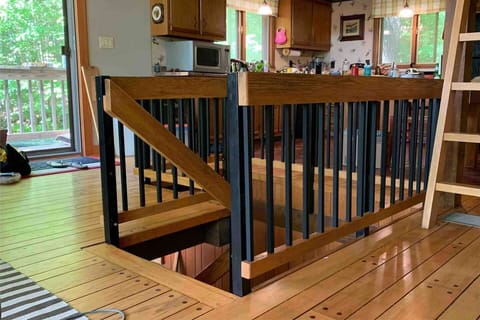 Stairs with child-safe railings NOTE: There is a ladder to the loft