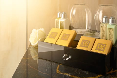 Shower, designer toiletries, hair dryer, bathrobes