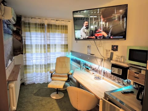 Luxury Double Room, 1 Queen Bed, Accessible, Refrigerator & Microwave | Living area | 32-inch flat-screen TV with cable channels, TV, table tennis