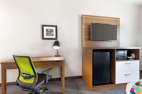 Desk, laptop workspace, iron/ironing board, cribs/infant beds