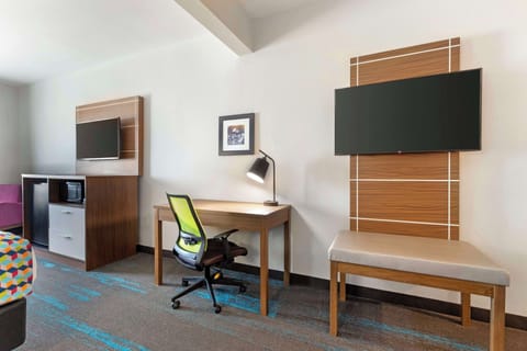 Desk, laptop workspace, iron/ironing board, cribs/infant beds