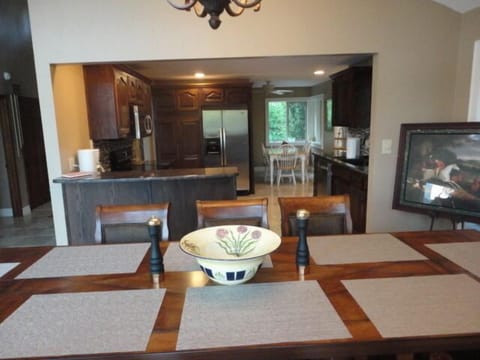 From the counter height dining room you can see the smaller eat-in kitchen table