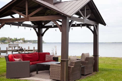 Covered lounge space with couches and wine-ready ambiance.