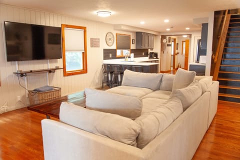 Living area – Cozy up in the open-concept space with a large sectional.