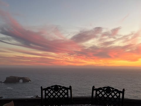 Sunset over Arch Rock, facing center on front deck