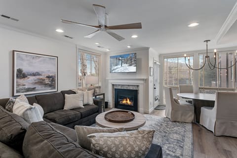 Remodeled living room at Three Kings 83 with fireplace and plush sectional 