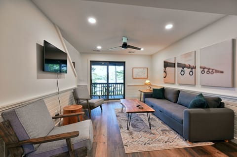 Living area with lake views and sofa sleeper.