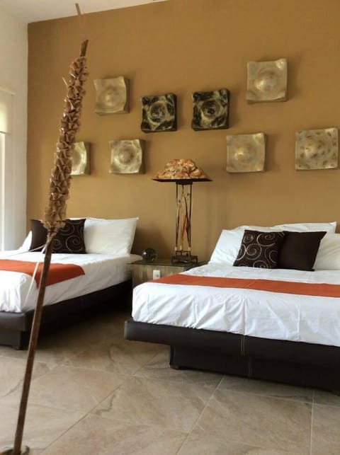 Deluxe Quadruple Room | Egyptian cotton sheets, premium bedding, in-room safe