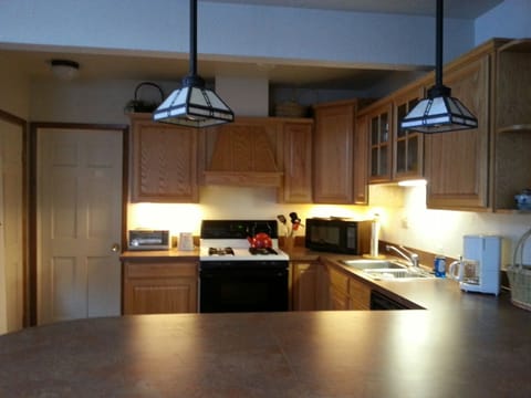 washer/dryer in separate laundry behind kitchen 