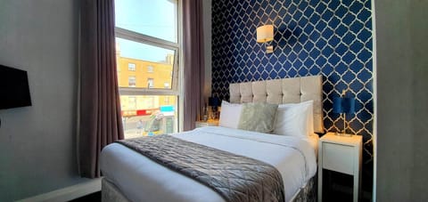 Premium bedding, desk, laptop workspace, iron/ironing board