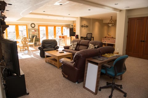 Relaxing family area, with foosball, working desk, and day bed