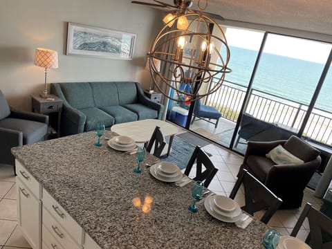 Modern kitchen with large peninsula. Has a great view and plenty of seating.