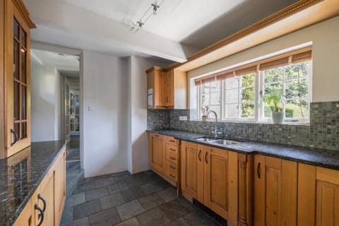 fully fitted kitchen with garden views