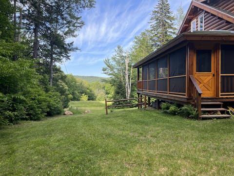 Cabin view of field and ridge line. Enjoy stream sounds from the screened porch.