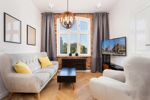 Living room of Starowiślna 54/21 with sofa, coffee table and tv