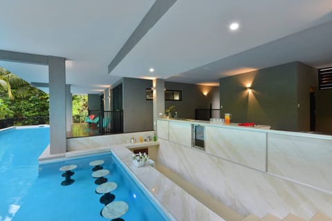 Relax at the swim up pool bar.