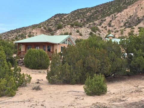 Temperature efficient adobe construction, modern design, lots of natural light.