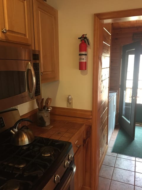 Alternate extinguisher and washer/dryer to the right as you walk in to the house