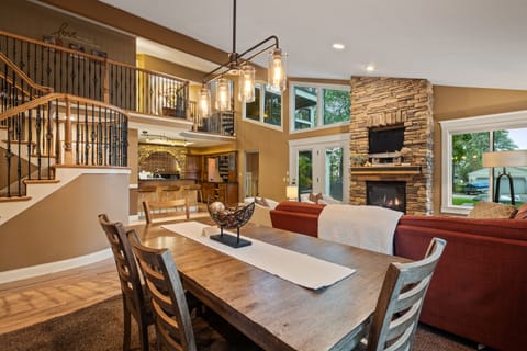 Dining area and great room with fireplace.