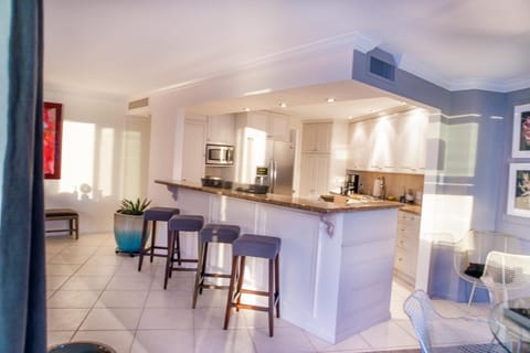 Open kitchen with breakfast counter.