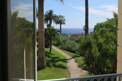 View over the gardens to the Mediterranean .
