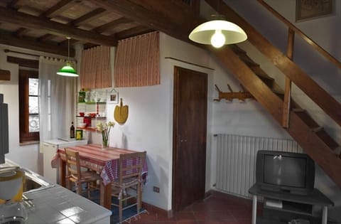 The bathroom door and the staircase leading to the loft