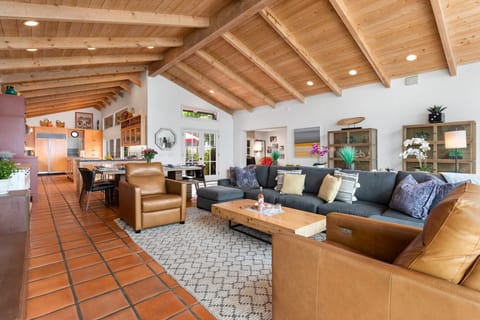 Living area towards kitchen and dining